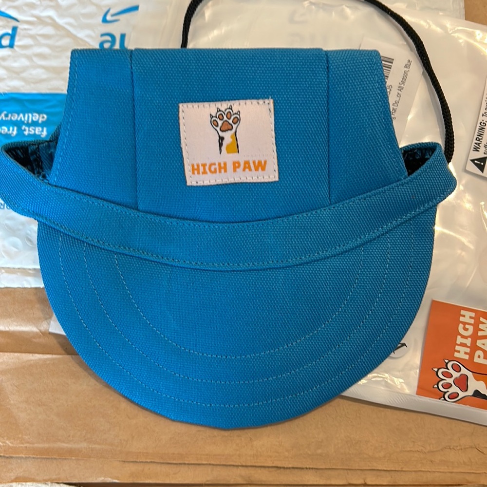 High paw dog hat with adjustable strap in back